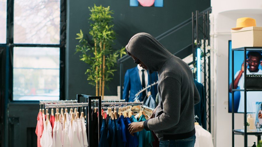 Thief Robbing Retail Store